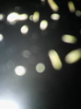 Abstract particles in black background with different elements in blurry effe Foto stock