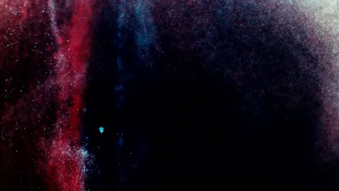 Abstract particles of blue and pink liquid flow and float motion on black Stock Footage 138593174