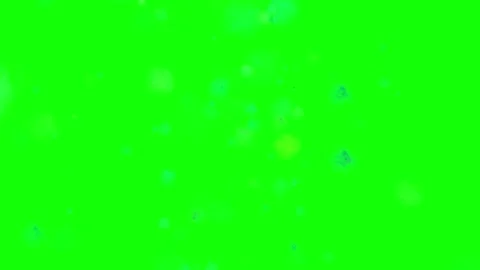 Abstract Particles Exploding Against a Solid Green Background Stock Footage 304632601