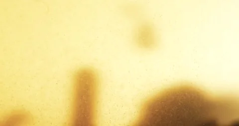 Abstract Particles Falling into a Murky Liquid Stock Footage 274955362