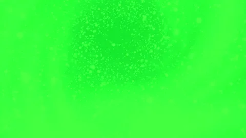 Abstract particles floating on a bright green screen background Stock Footage 339756916