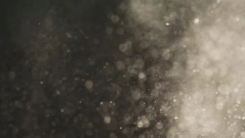 Abstract particles floating through space on dark background with bright li.. Stock Footage 337415736