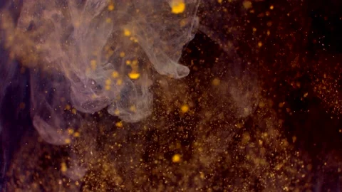 Abstract particles of gold liquid flow and float motion on black Vidéo 138592231