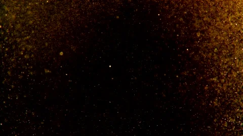 Abstract particles of gold liquid flow and float motion on black Stock Footage 138594590