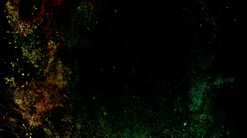 Abstract particles of orange liquid flow and float motion on black Stock Footage 138593822