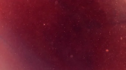 Abstract particles of pink and orange liquid flow and float motion on black Stock Footage 138593108