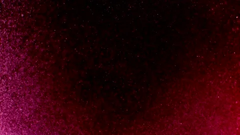Abstract particles of pink liquid flow and float motion on black Stock Footage 138594248