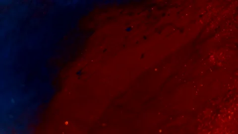 Abstract particles of red and blue liquid flow and float motion on black Stock Footage 138594610
