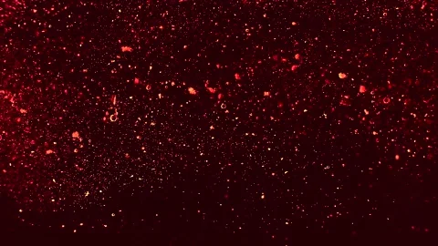 Abstract particles of red and orange liquid flow and float motion on black Stock Footage 138593551