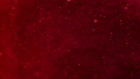 Abstract particles of red and orange liquid flow and float motion on black Stock Footage 138593613
