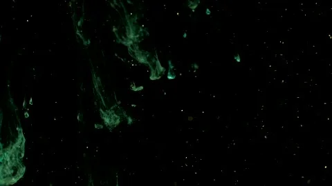 Abstract particles of red and orange liquid flow and float motion on black Stock Footage 138594033