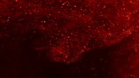 Abstract particles of red and orange liquid flow and float motion on black Stock Footage 138594086