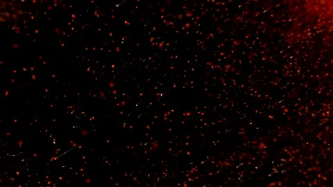 Abstract particles of red and orange liquid flow and float motion on black Stock Footage 138594712