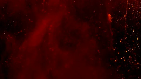 Abstract particles of red and orange liquid flow and float motion on black Stock Footage 138595079