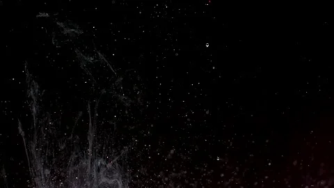 Abstract particles of silver liquid flow and float motion on black Stock Footage 138594384