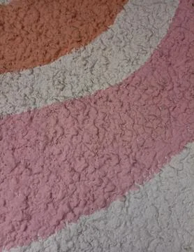 Abstract pastel wave patterns on textured plaster wall Stock Photos