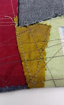 Abstract patchwork fabric coaster Stock Photos