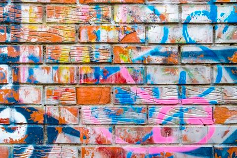 Abstract pattern on the background of an unplastered surface of a brick wall. Stock-Fotos