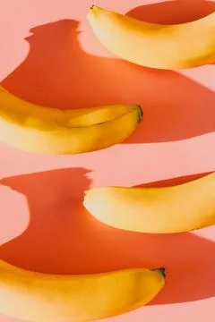 Abstract pattern of bananas isolated on pink background 写真素材