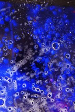 Abstract pattern of bubbles , water drops and blue paints Stockfoto's