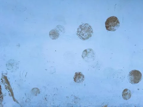 Abstract Pattern of Circular Stains on Blue Surface Фото