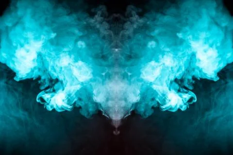 Abstract pattern of colored smoke backlit blue and turquoise in the shape of  Stock Photos