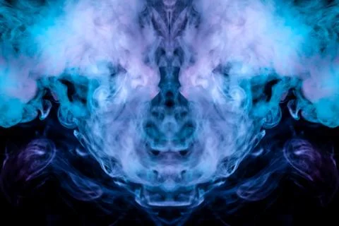 Abstract pattern of colored smoke backlit blue and turquoise takes the form o Stock Photos