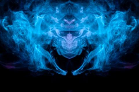 Abstract pattern of colored smoke backlit blue and turquoise takes the form o Stock Photos