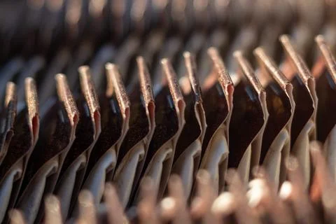 Abstract pattern of copper heat exchanger fins in industrial cooling system Stock Photos