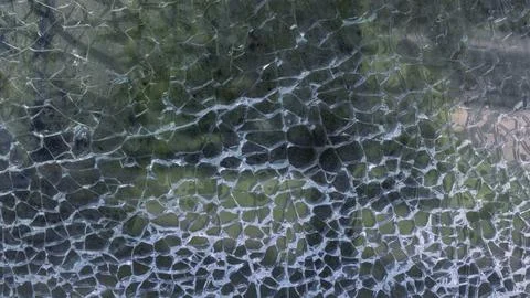 Abstract pattern of cracks on glass Foto stock