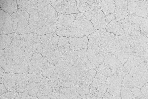 Abstract pattern of cracks on a white concrete wall surface, background Foto stock