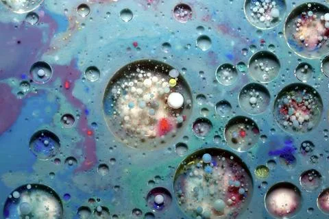 Abstract pattern created by air bubbles floating in paint. Wallpaper. Stock Photos