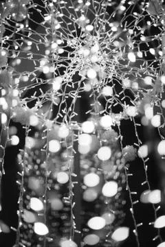 Abstract pattern created by reflection of lights holiday illumination. Stock Photos