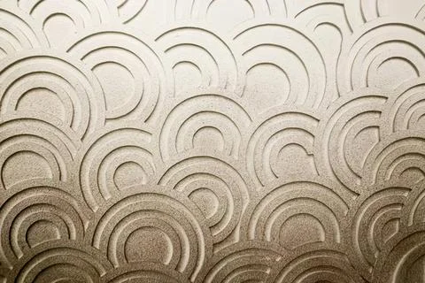 Abstract pattern of curved lines on a textured wall Stock Photos