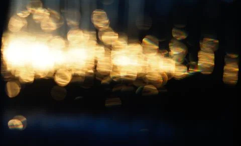 Abstract pattern de-focused points of golden light against the dark blue Stock Photos