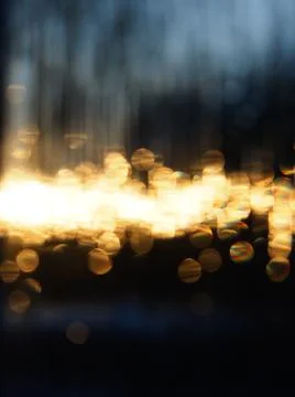 Abstract pattern de-focused points of golden light against the dark blue Stock Photos