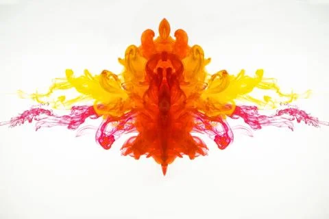 Abstract pattern of droplets of ink mixing under water. Coloured smoke Stock Photos