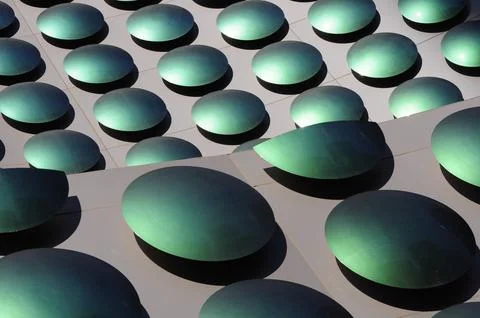 Abstract pattern formed by green polka dots, in the decoration of a buildin.. Stock Photos