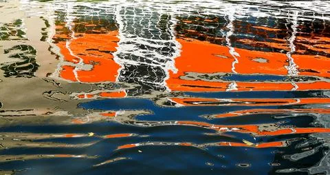 Abstract pattern formed by the reflection of a building on rippled water Stock Photos
