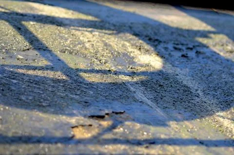 Abstract pattern formed by the shadow of a fence. Stock Photos