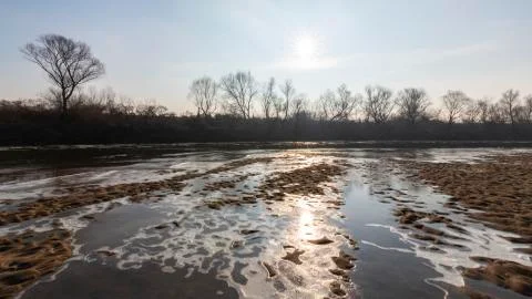 Abstract pattern with fresh snow on a sandy river beach 写真素材
