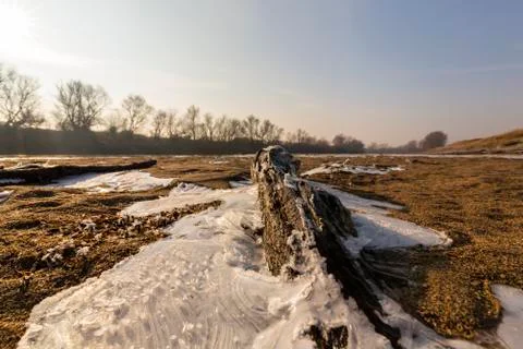 Abstract pattern with fresh snow on a sandy river beach 写真素材