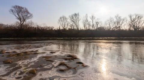 Abstract pattern with fresh snow on a sandy river beach 写真素材