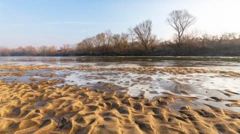 Abstract pattern with fresh snow on a sandy river beach 写真素材