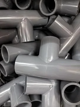 Abstract Pattern of Grey PVC Pipe T-Joints Stock Photos