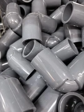 Abstract Pattern of Grey PVC Pipe T-Joints Stock Photos