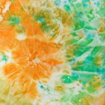 Abstract pattern on handmade silk batik abstract knot green and orange pat... Foto stock