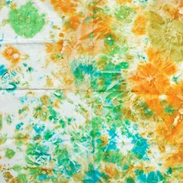 Abstract pattern on handmade silk batik abstract nodular green and orange ... 스톡 사진