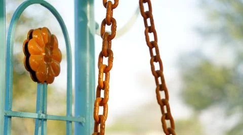 Abstract pattern of Hanging Iron Chain with golden color. Curved chain view w Stock Photos