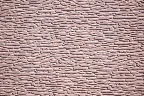 Abstract pattern with horizontal embossed texture on a rough wall surface Фото